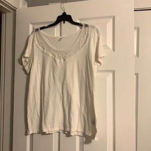 White shirt with design around neck